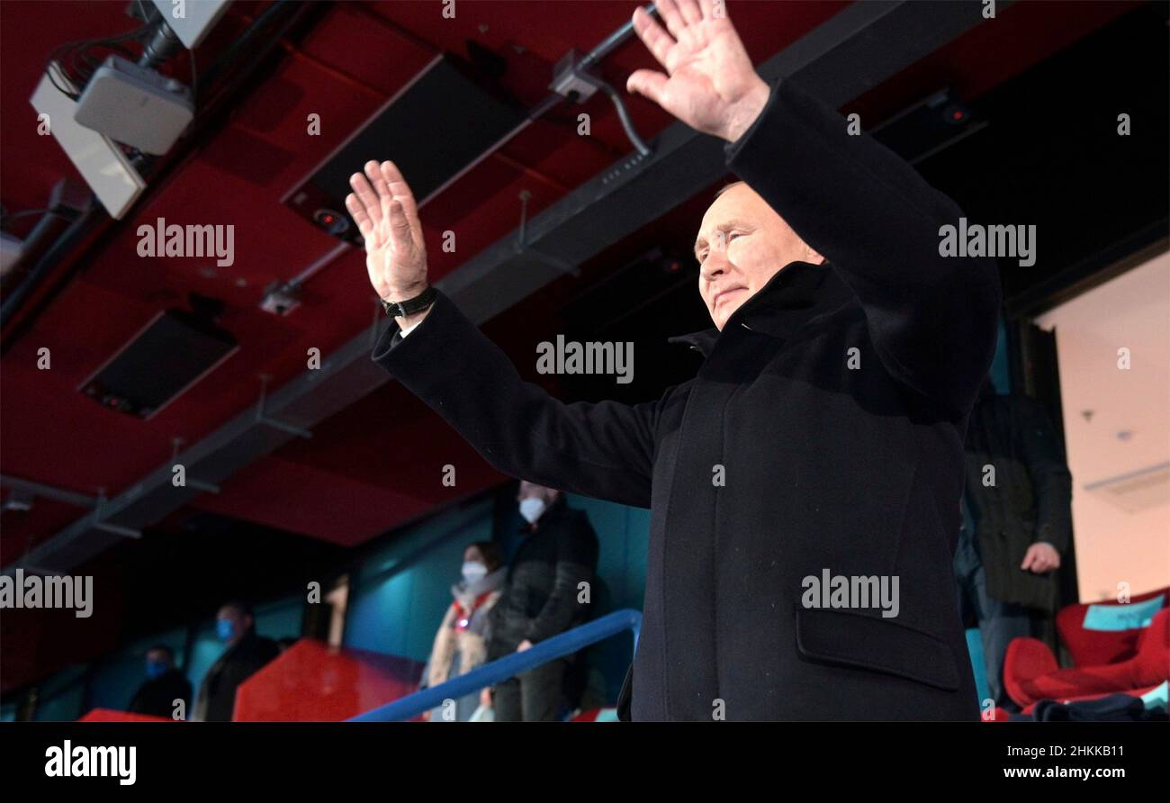 Beijing, China. 04th Feb, 2022. Russian President Vladimir Putin waves as athletes from the Russian Olympic Committee enter the stadium during the opening ceremony of the 2022 Beijing Winter Olympics in the VIP section of National Stadium, February 4, 2022 in Beijing, China. Putin attended the Olympics as a guest of Chinese President Xi Jinping. Credit: Alexei Druzhinin/Kremlin Pool/Alamy Live News Stock Photo