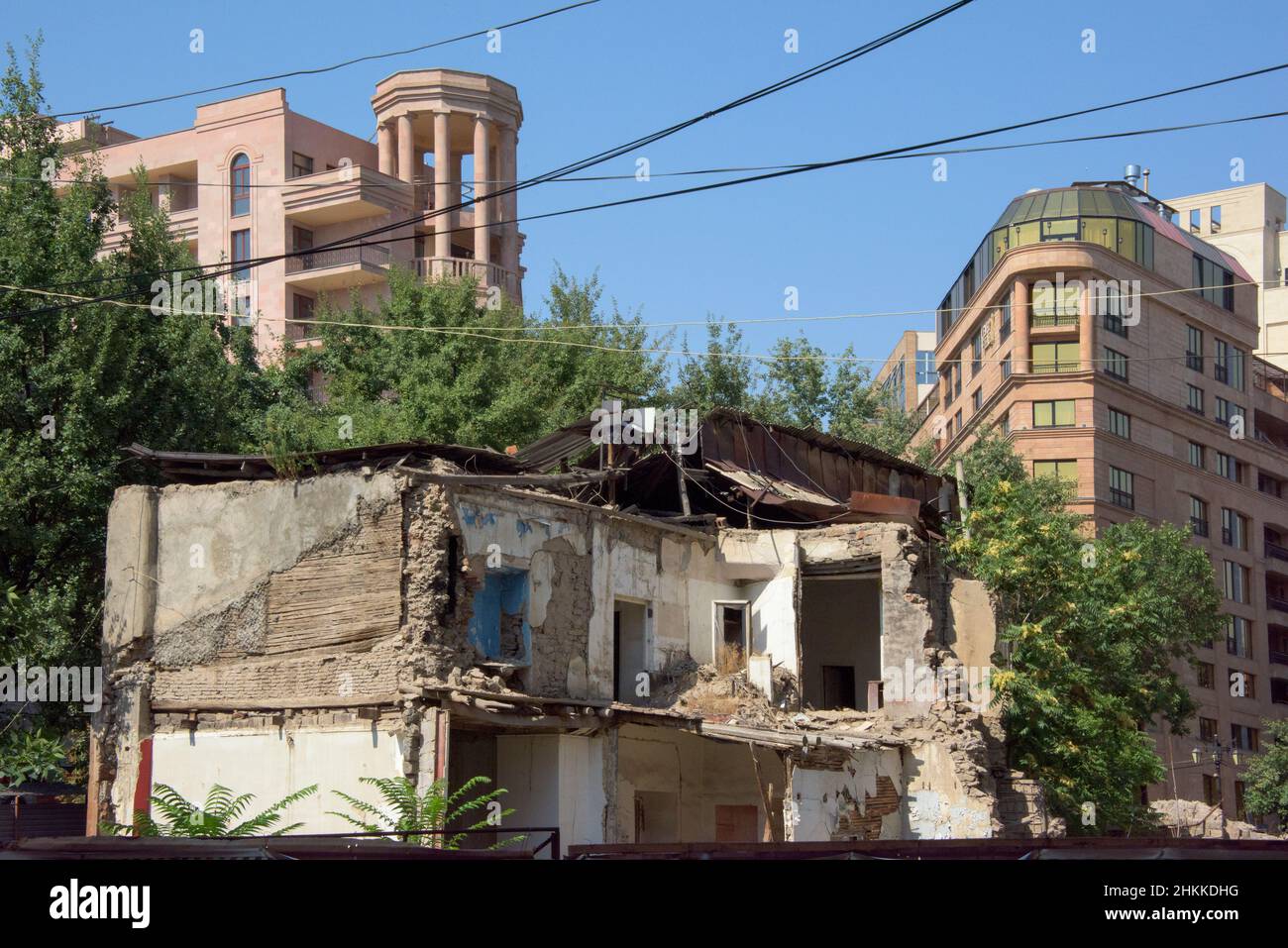 Old house and new building, Yerevan, Armenia Stock Photo