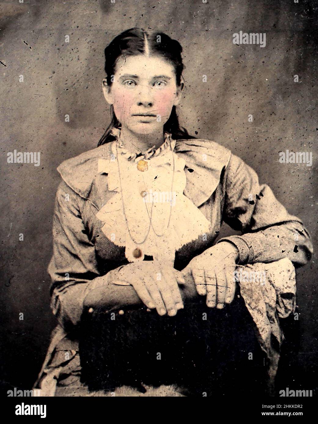 A beautiful young woman is shown in a 1870s tintype photograph. Stock Photo