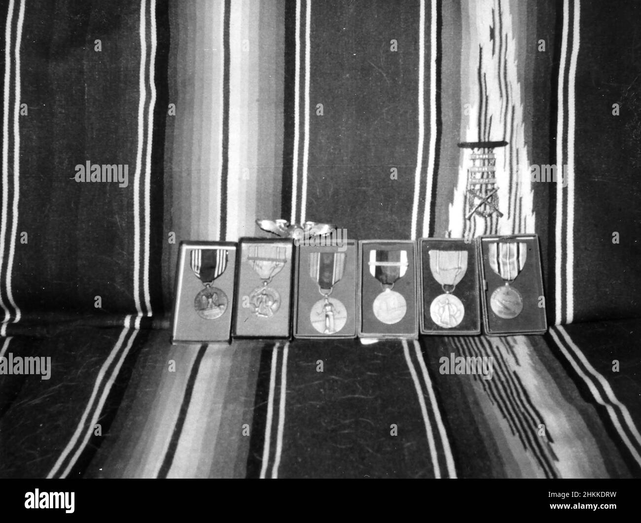 U.S. military service medals are lined up on a couch, ca. 1960. Stock Photo