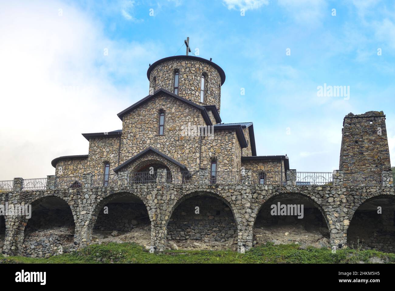 View of the Iversky Cathedral of the Alan Holy Assumption Monastery on September cloudy day. North Ossetia-Alania, Russian Federation Stock Photo