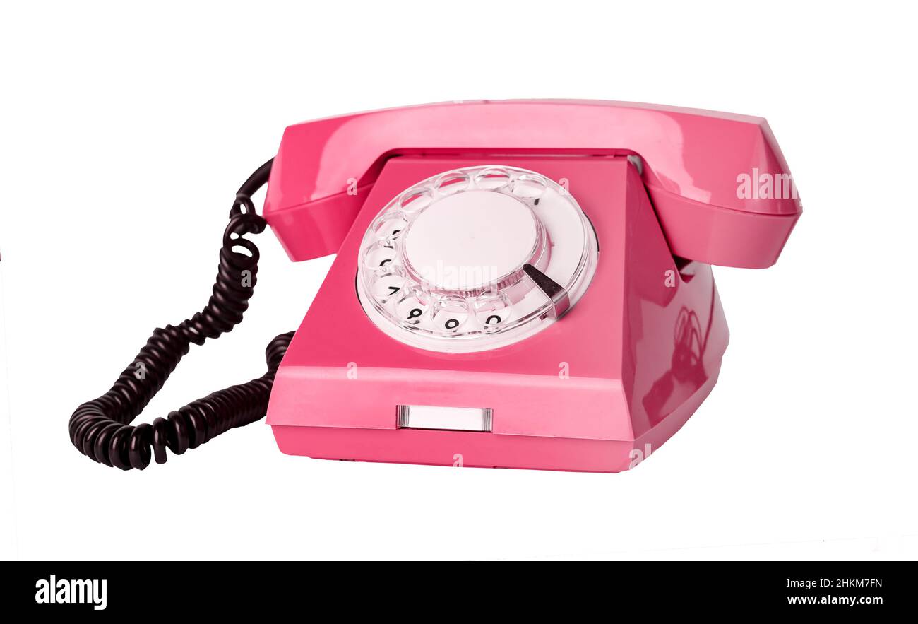 Pink retro phone isolated on white background. Telephone with rotary