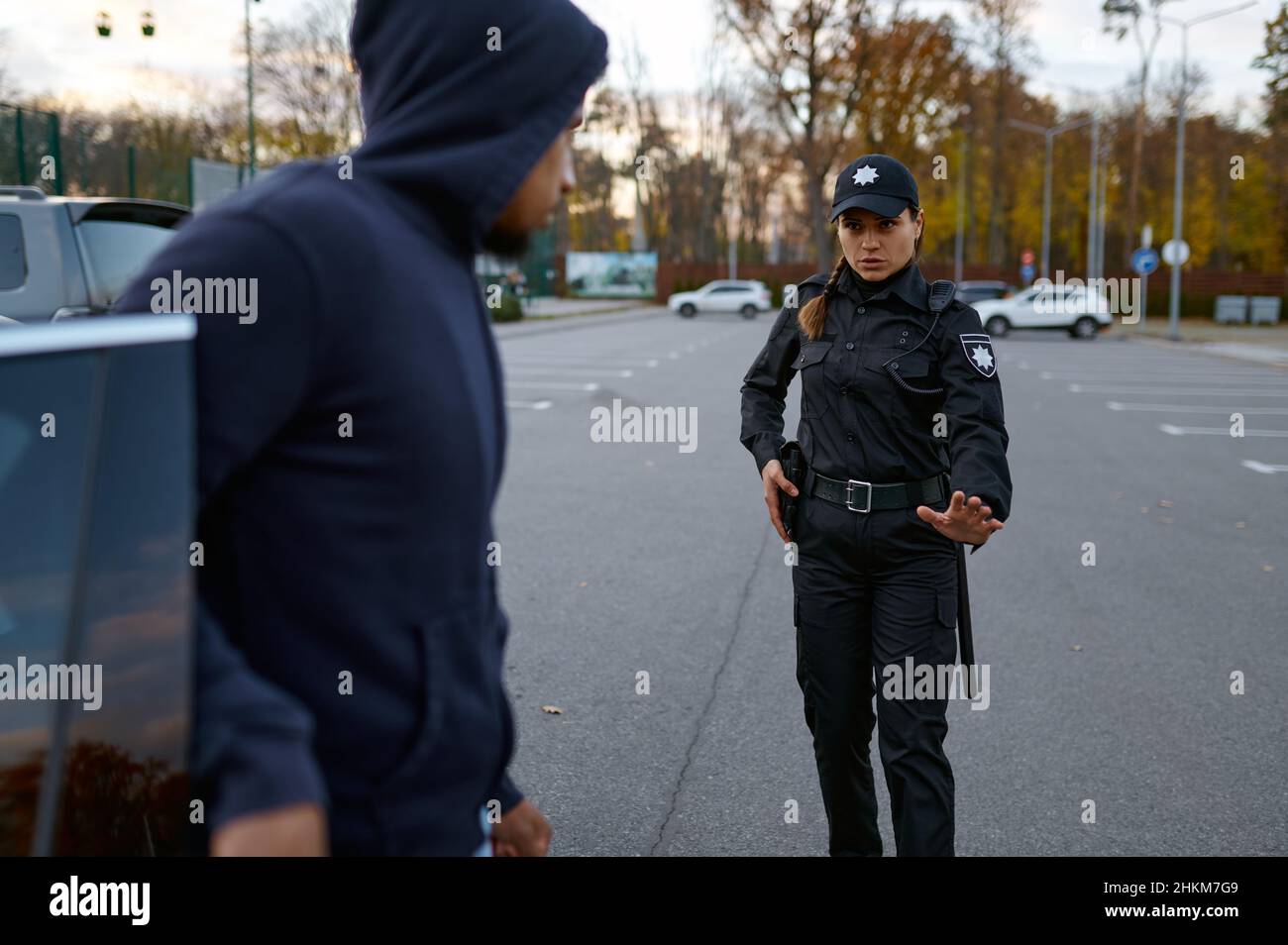 Police officer trying talk with car thief Stock Photo - Alamy
