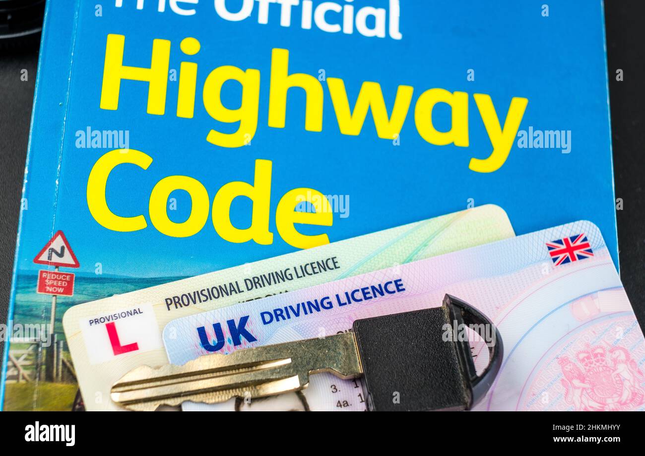 UK Driving Licence. Provisional and Full licence cards placed on Highway Code book and car key on top of them. Stafford, United Kingdom, January 30, 2 Stock Photo