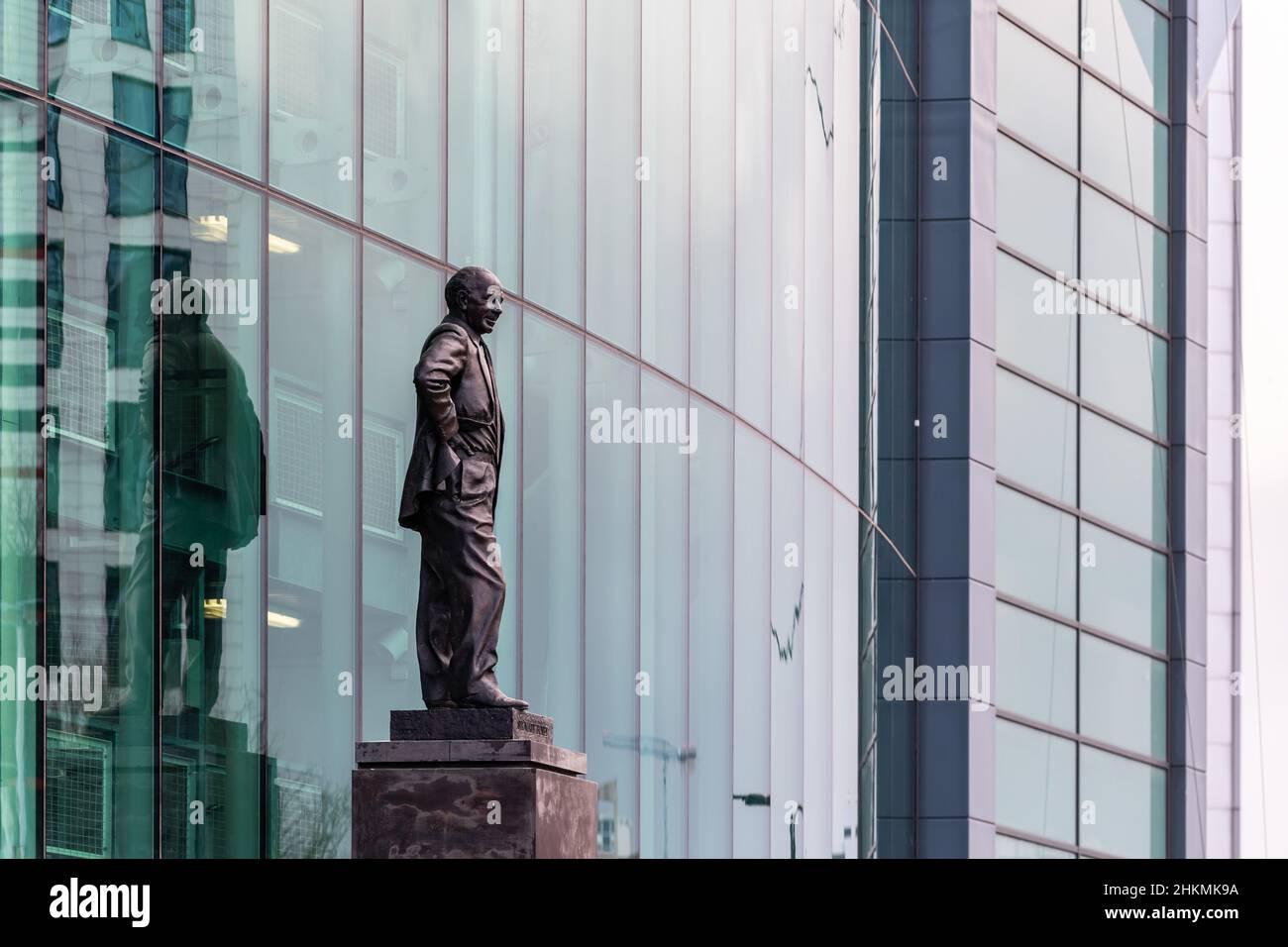 Old Trafford football ground, home to Manchester United FC. Sir Matt Busby statue. Stock Photo