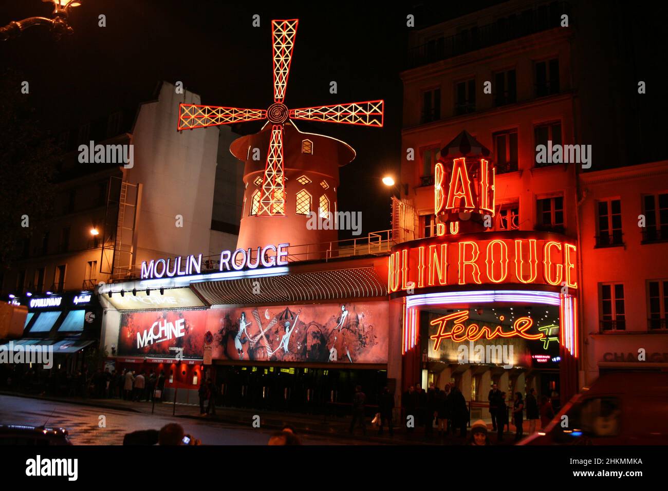France, Paris - legendary Moulin Rouge during the night with a lot of red neon lights Stock Photo