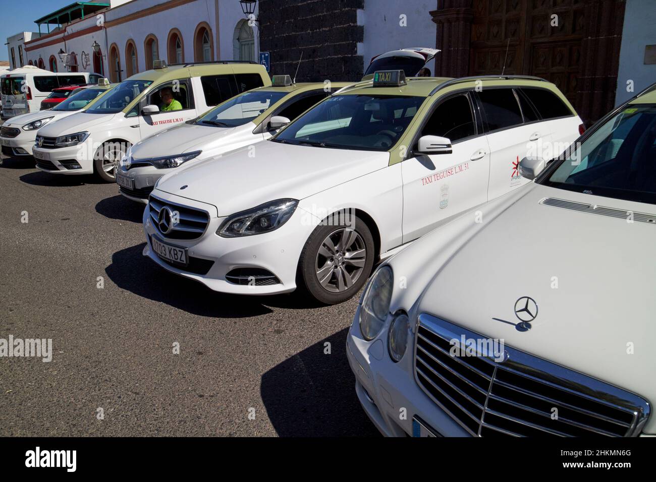 green and white teguise taxis waiting for fares on market day Teguise Lanzarote Canary Islands Spain Stock Photo