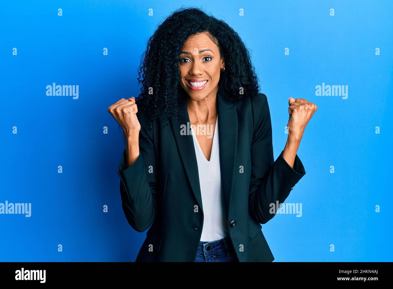 Middle age african american woman wearing business clothes celebrating ...