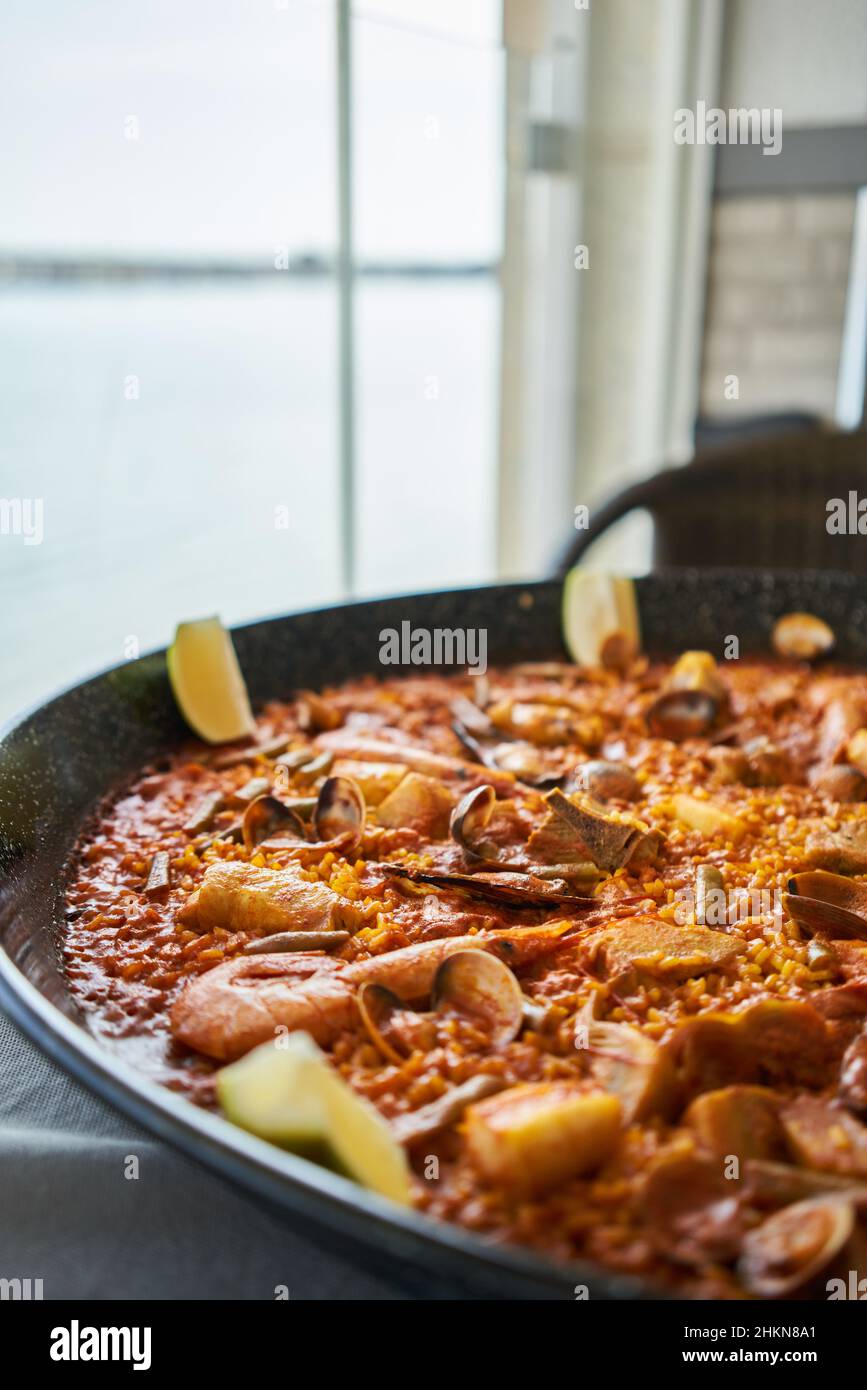 Delicious spanish shellfish paella on cloth surface Stock Photo Alamy