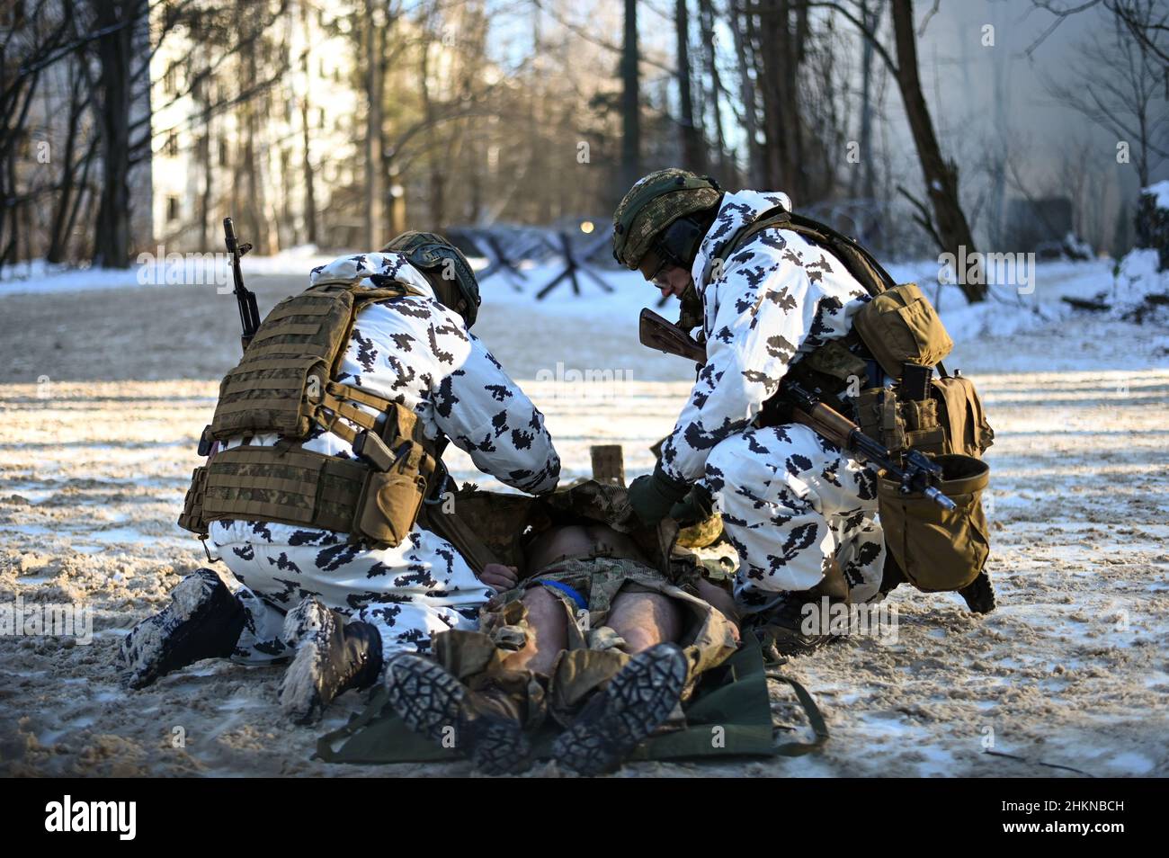 Pripyat, Ukraine. 04th Feb, 2022. Two Ukrainian National Guard soldiers perform tactical casualty care on a simulated casualty during an urban warfare exercise held in the village of Pripyat near the Belarussian border by the Ukrainian Ministry of Internal Affairs, as Russian forces continue to mobilize on the country's borders on February 4, 2022 in Pripyat, Ukraine. (Photo by Justin Yau/Sipa USA) Credit: Sipa USA/Alamy Live News Credit: Sipa USA/Alamy Live News Stock Photo
