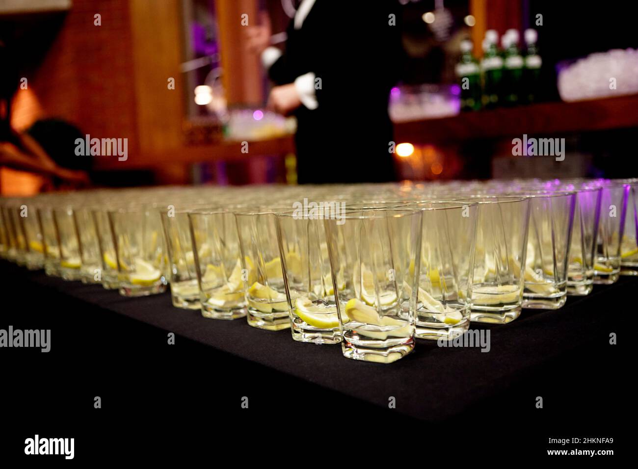 gin and tonic glasses set out prepared to be filled at a corporate