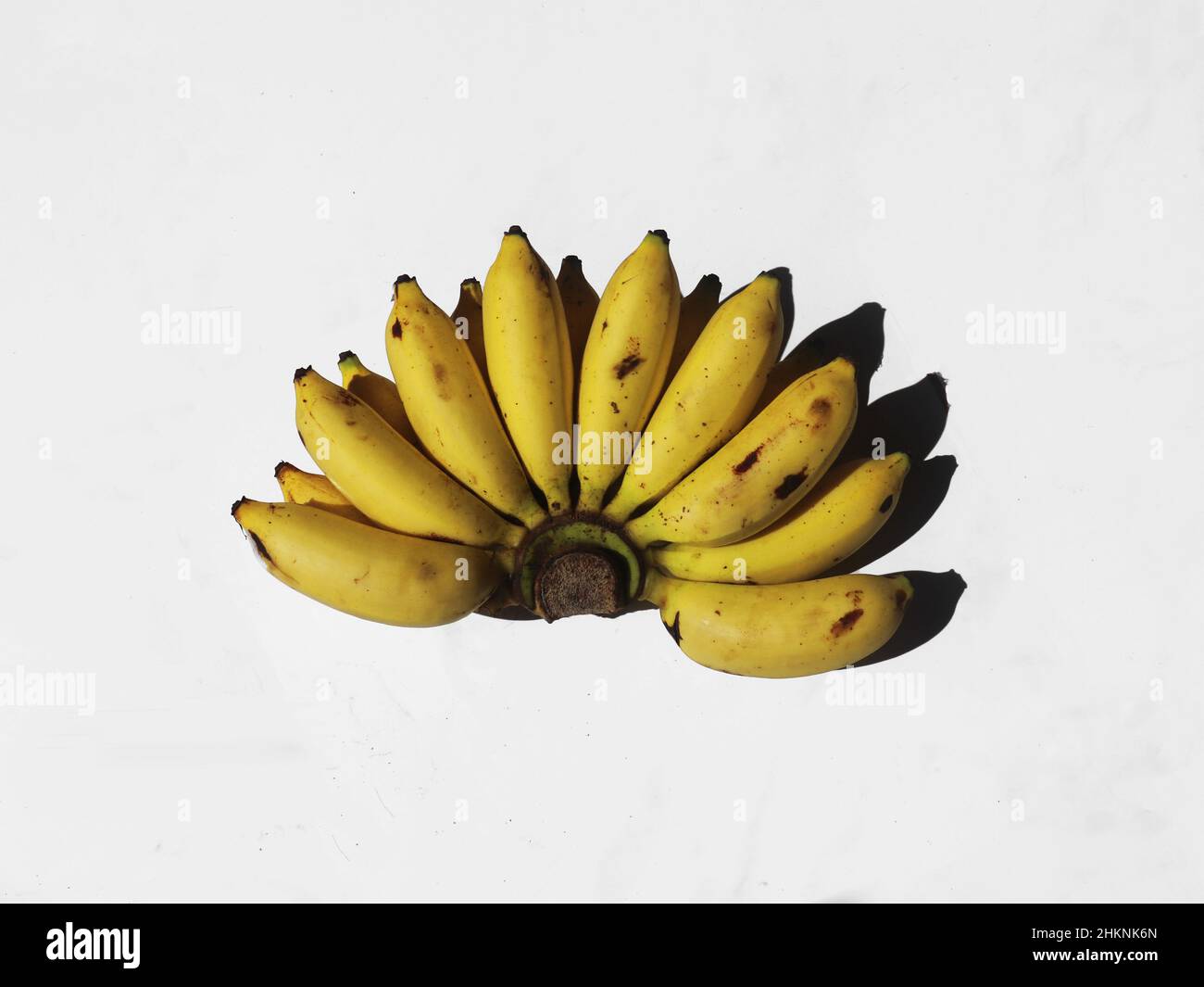 A hand of fresh banana on white background Stock Photo