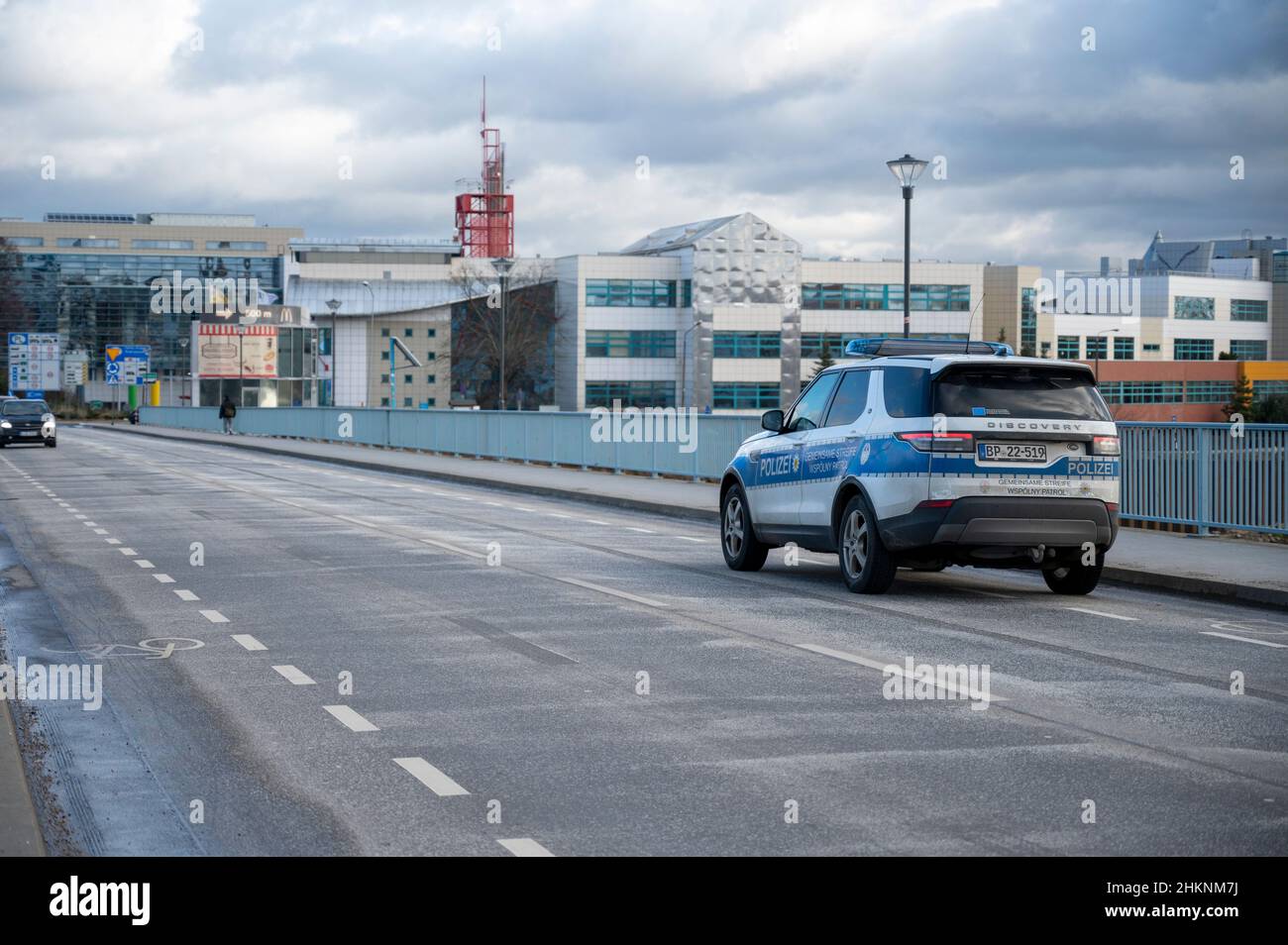 Slubice, Poland. 05th Feb, 2022. A police car drives on the border between Poland and Germany. Due to a reduction in VAT on food and fuel from 23 to 8 percent, filling up with gas in Poland is significantly cheaper than in Germany. Credit: Christophe Gateau/dpa/Alamy Live News Stock Photo