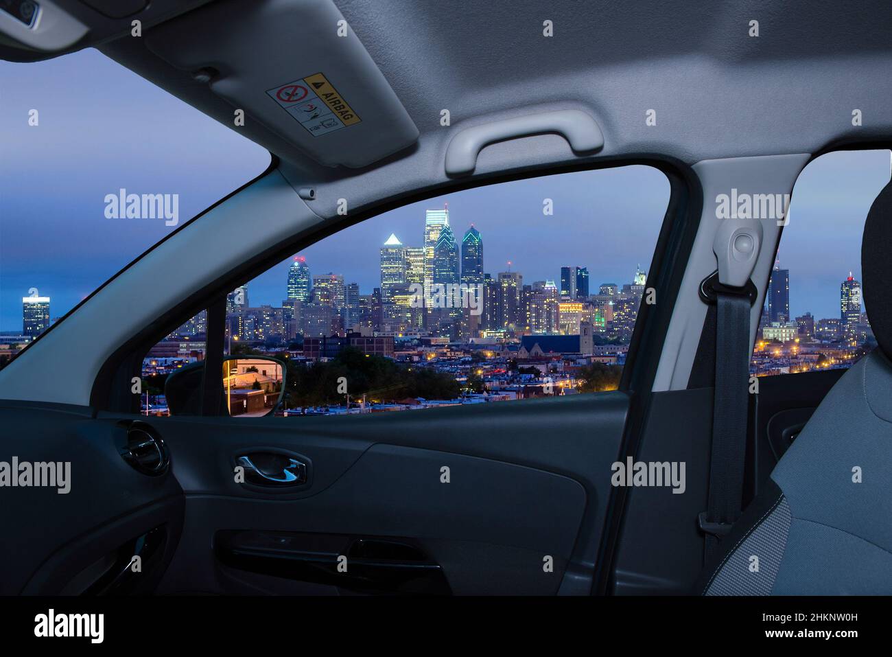 Looking through a car window with view of Philadelphia skyline at night