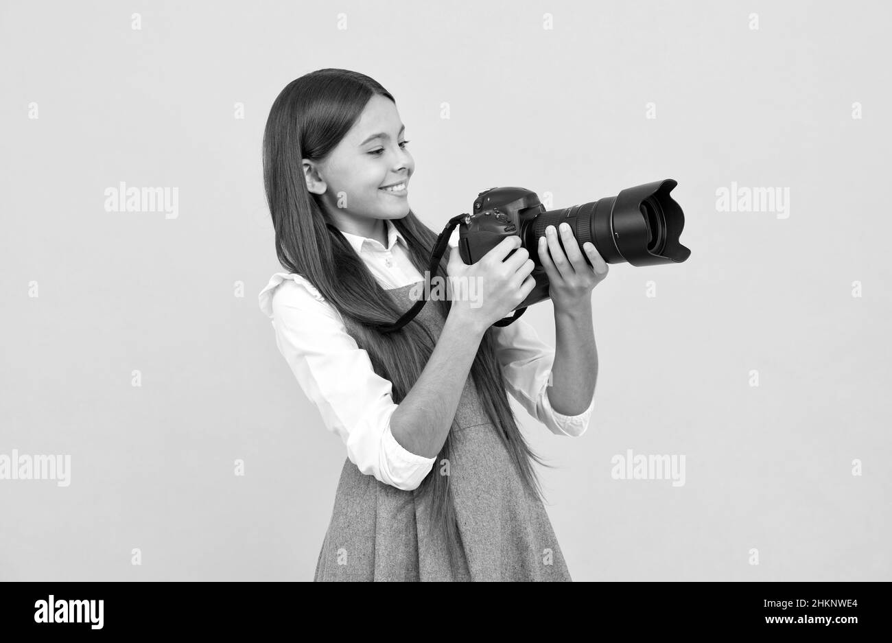 having skills. snapshot. childhood. teen girl taking photo. kid use digital camera. Stock Photo