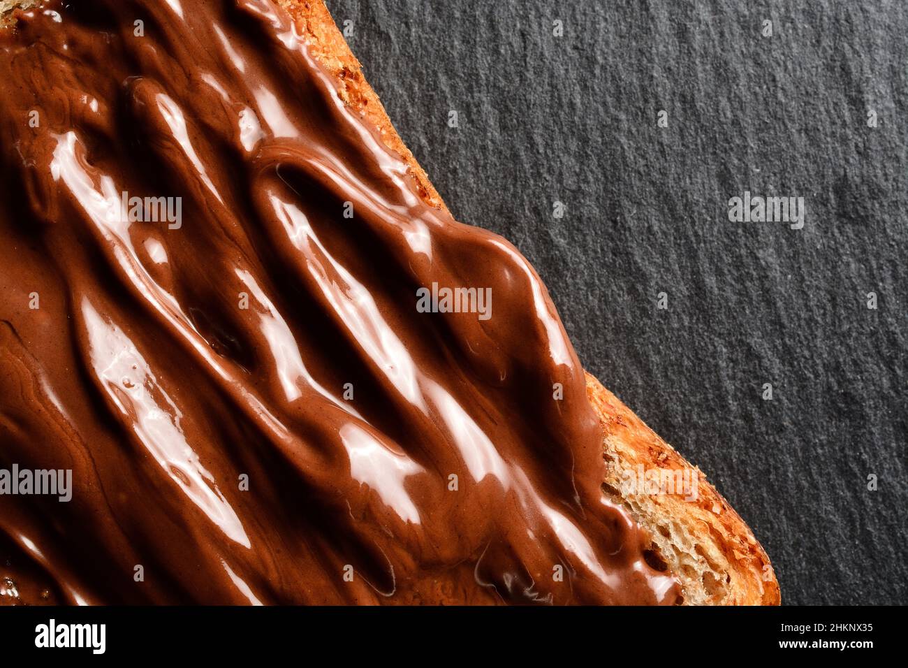 Hazelnut cream spread on a slice of wholemeal bread Stock Photo Alamy