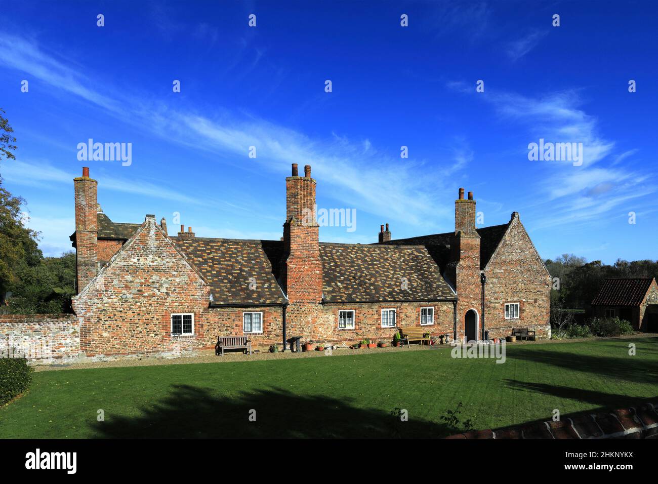 Hospital of the Holy and Undivided Trinity Almshouses, Church of St Lawrence, Castle Rising village, North Norfolk, England, UK Stock Photo