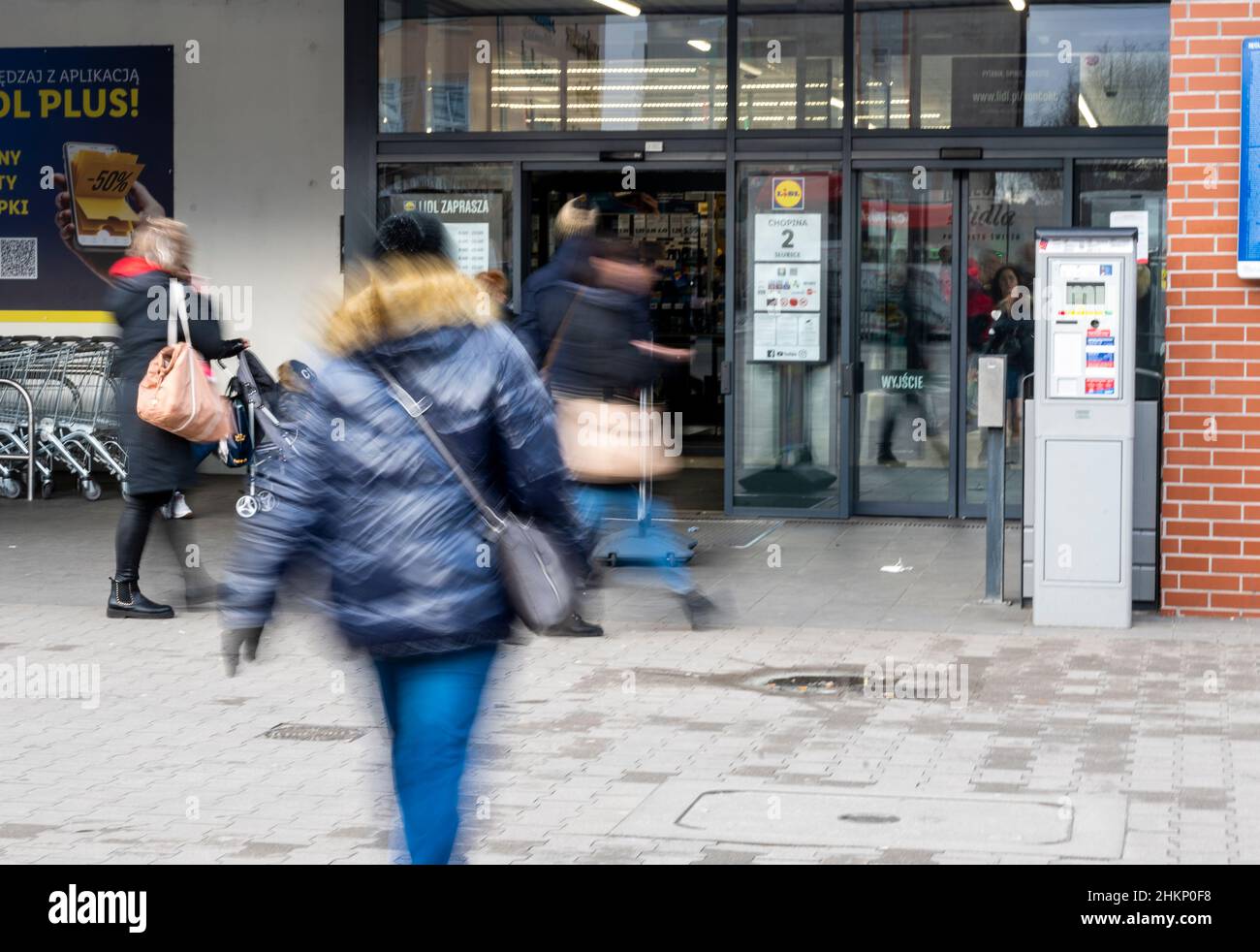 Slubice, Poland. 05th Feb, 2022. People go to a supermarket. Due to a reduction in VAT on food and fuel from 23 to 8 percent, food in Poland is sometimes significantly cheaper than in Germany. Credit: Christophe Gateau/dpa/Alamy Live News Stock Photo