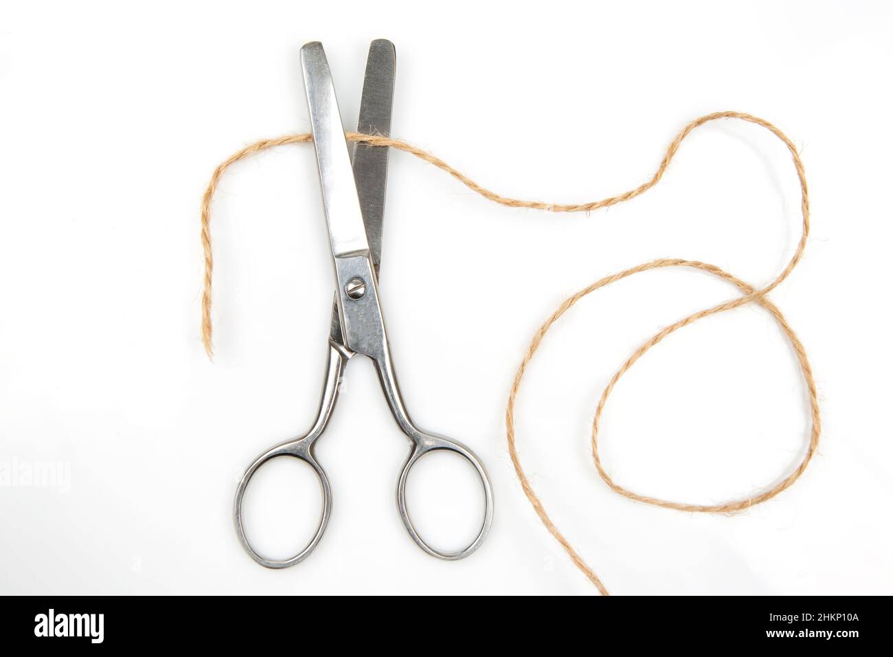 cutting scissors and thread rope isolated on white background Stock ...