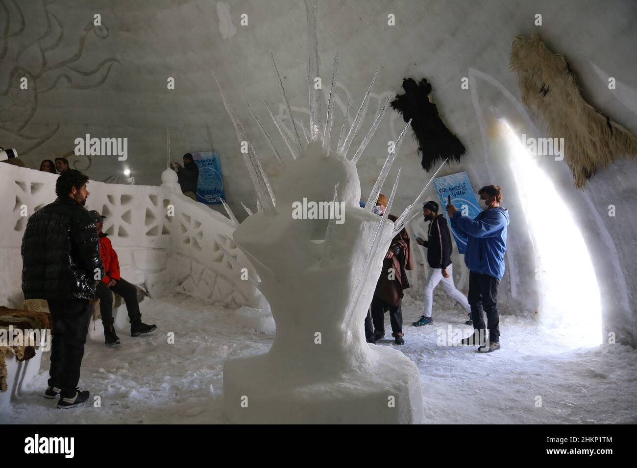 Kashmir, India. 05th Feb, 2022. February 5, 2022, Srinagar, Jammu and Kashmir, India: Indian tourists take pictures inside Asia's biggest Igloo Cafe made of snow in Gulmarg. The Igloo Cafe is approximately 37.5 feet tall and 45 feet round and can accommodate fifteen tables and around 60 guests. The Igloo Cafe offers tables made of ice and snow, with hot dishes served to visitors. (Credit Image: © Sajad Hameed/Pacific Press via ZUMA Press Wire) Credit: ZUMA Press, Inc./Alamy Live News Stock Photo