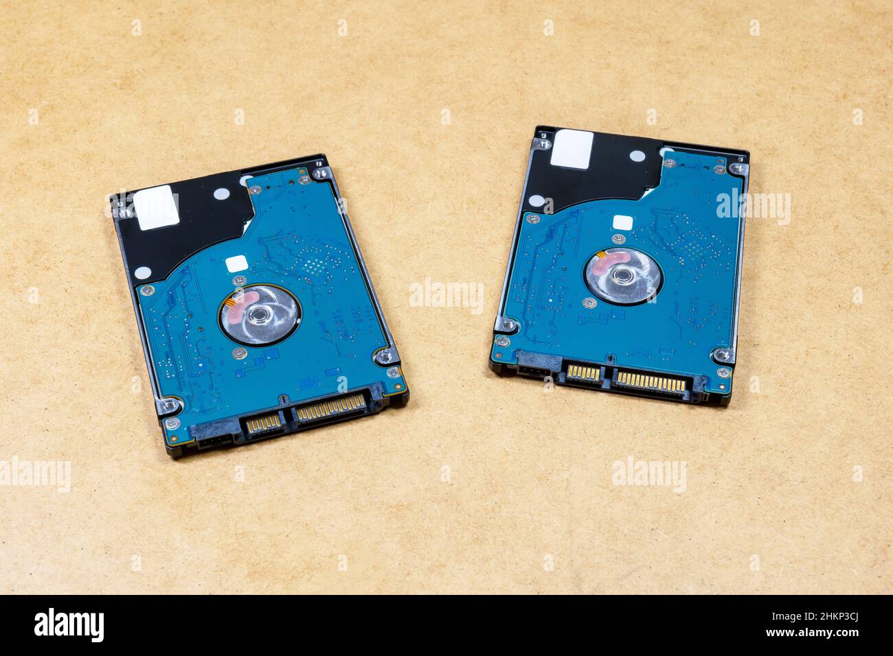 Two simple identical HDD hard drives, objects closeup, nobody. Digital data storage, media backup, copying files, storing information, disk image, dat Stock Photo