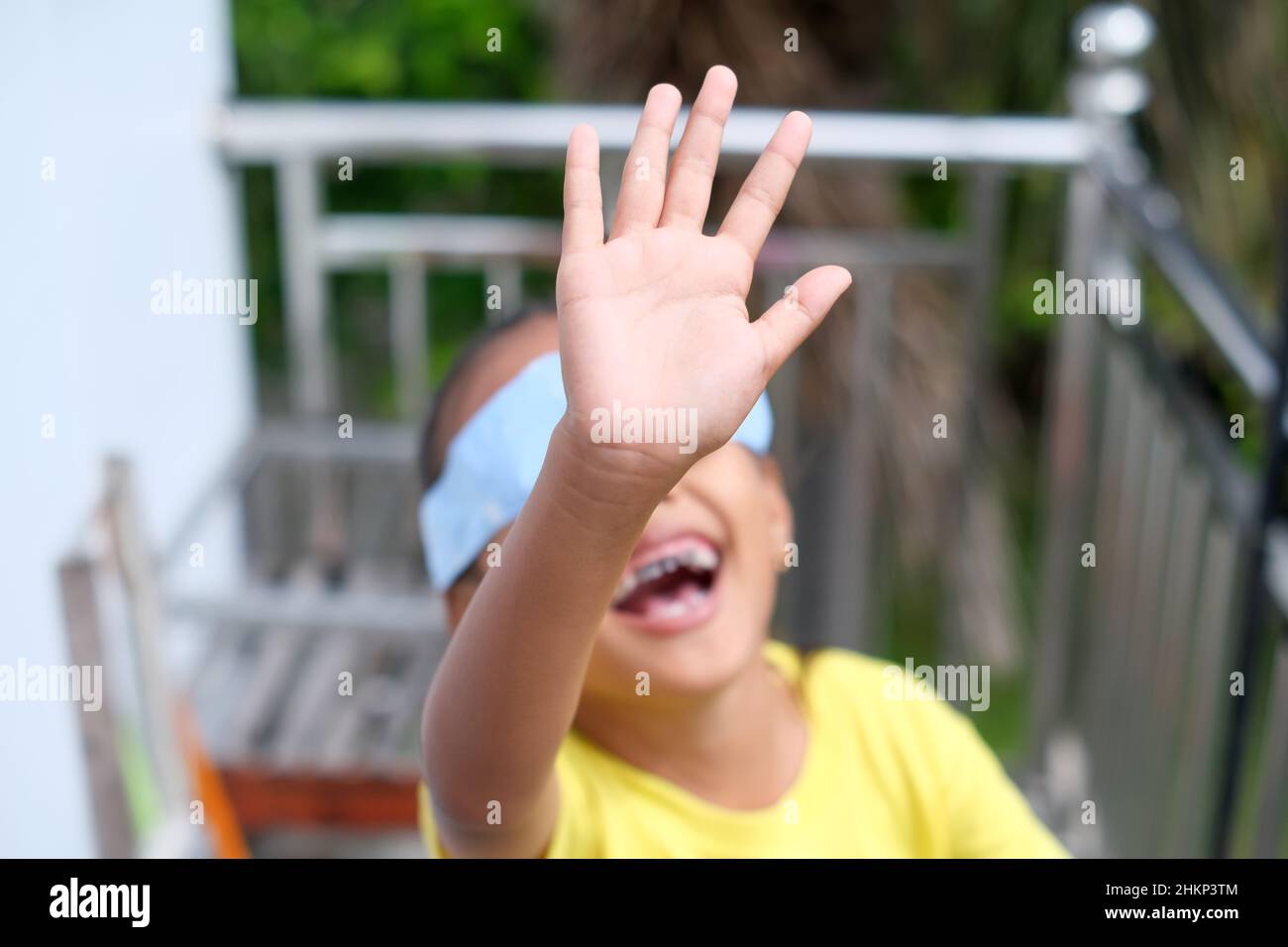 Focus on hand. Little girl eyes closed hands resisting with hands. The concept of violence against children Stock Photo