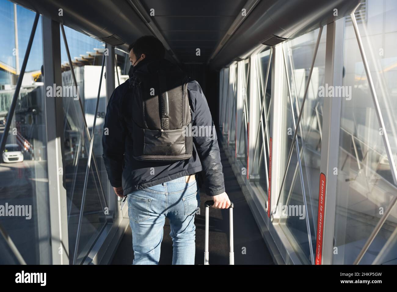 Passenger entering the airport with their bags Stock Photo