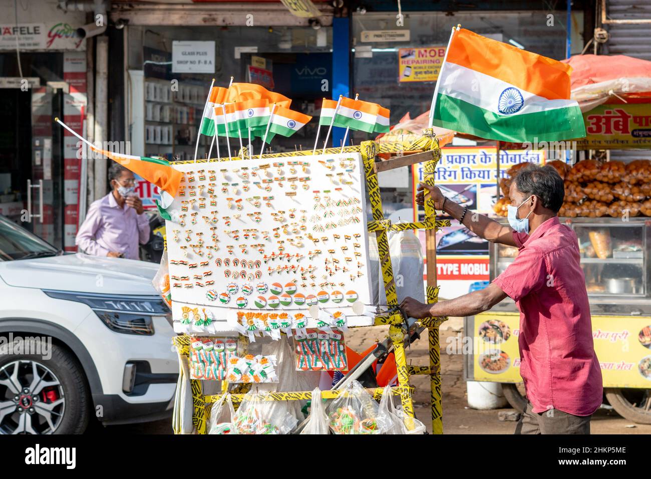 Adult man selling Indian flags and souvenirs on the streets of Mumbai