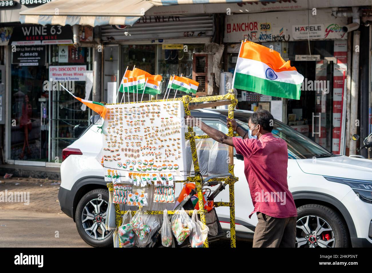 Adult man selling Indian flags and souvenirs on the streets of Mumbai