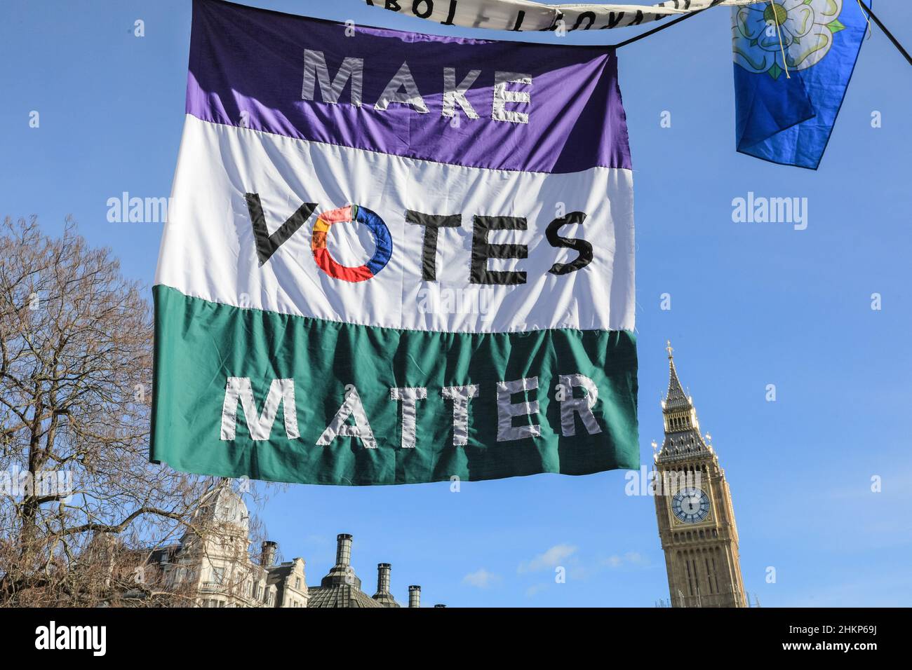 London, UK. 5th Feb, 2021. Protesters and speakers are gathered in Parliament Square for the 'Say No to the Elections Bill' rally, organised by Make Votes Matter, to support proportional representation in Parliament. Cross party speakers are joined by activists from the unions, Make Votes Matter, pro European groups, pro democracy and 'Resign Boris Johnson' protesters. Credit: Imageplotter/Alamy Live News Stock Photo