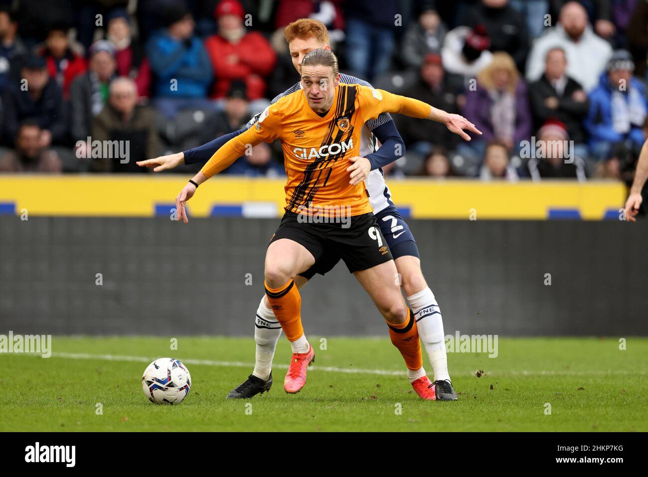 Hull City's Tom Eaves and Preston North End's Sepp van den Berg in