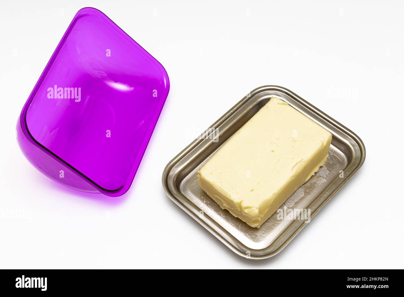 a piece of butter lies in a butter dish Stock Photo Alamy