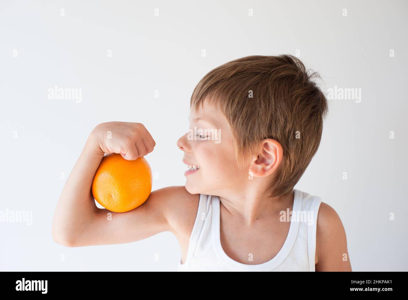healthy little kid wants to eat orange Stock Photo Alamy