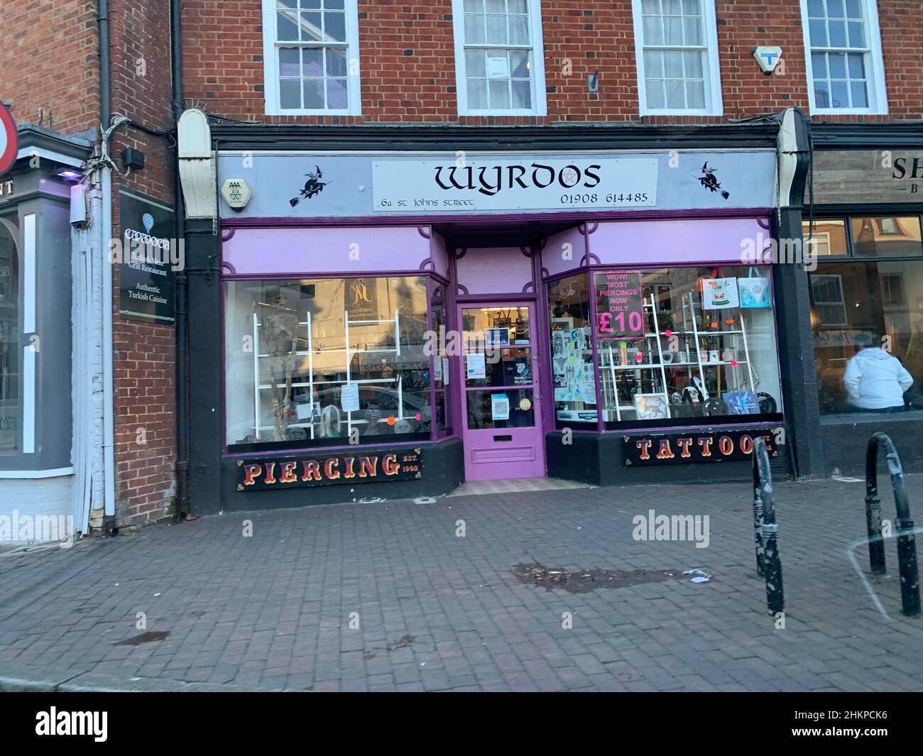 ear piercing and tattoos Newport Pagnell Milton Keynes UK purple front