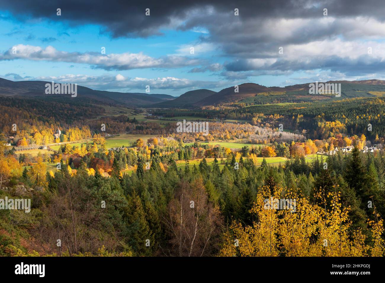 BALMORAL ROYAL DEESIDE SCOTLAND AUTUMN SCENE VIEW OF CRATHIE CHURCH THE RIVER DEE ESTATE HOUSES AND COLOURFUL TREES Stock Photo