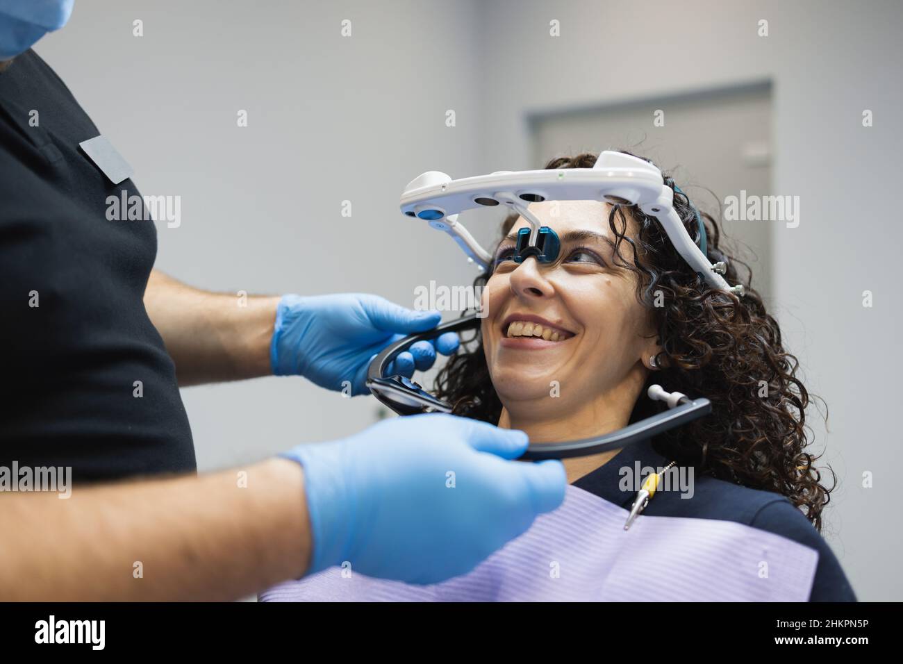 Doctor orthodontist installs a system for diagnosing jaw joints and