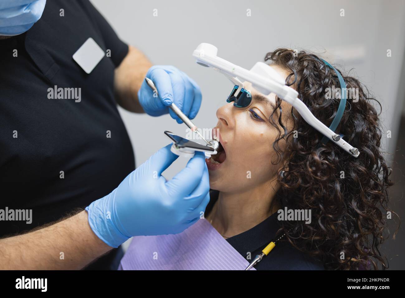 Doctor orthodontist installs a system for diagnosing jaw joints and