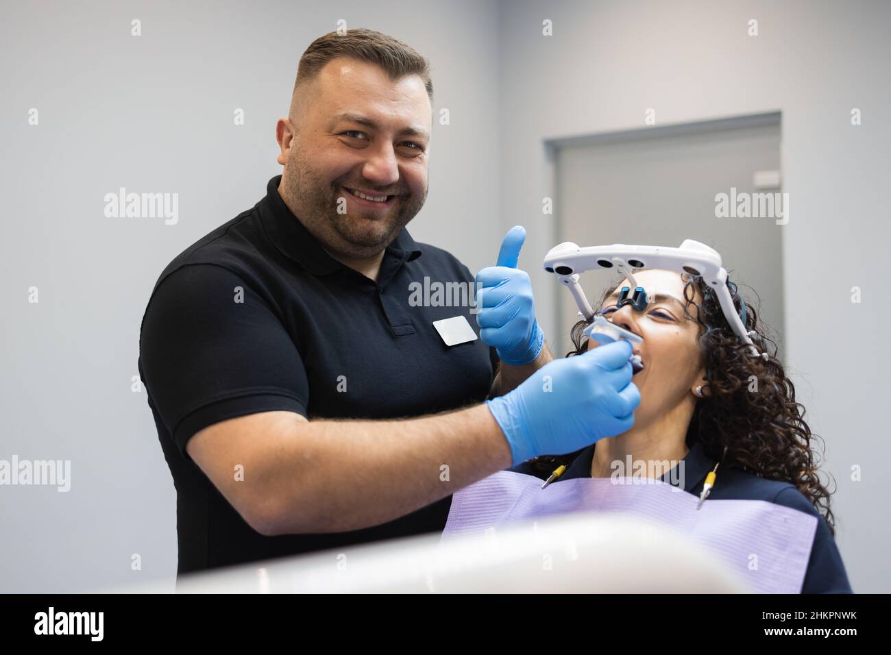 Doctor orthodontist installs a system for diagnosing jaw joints and