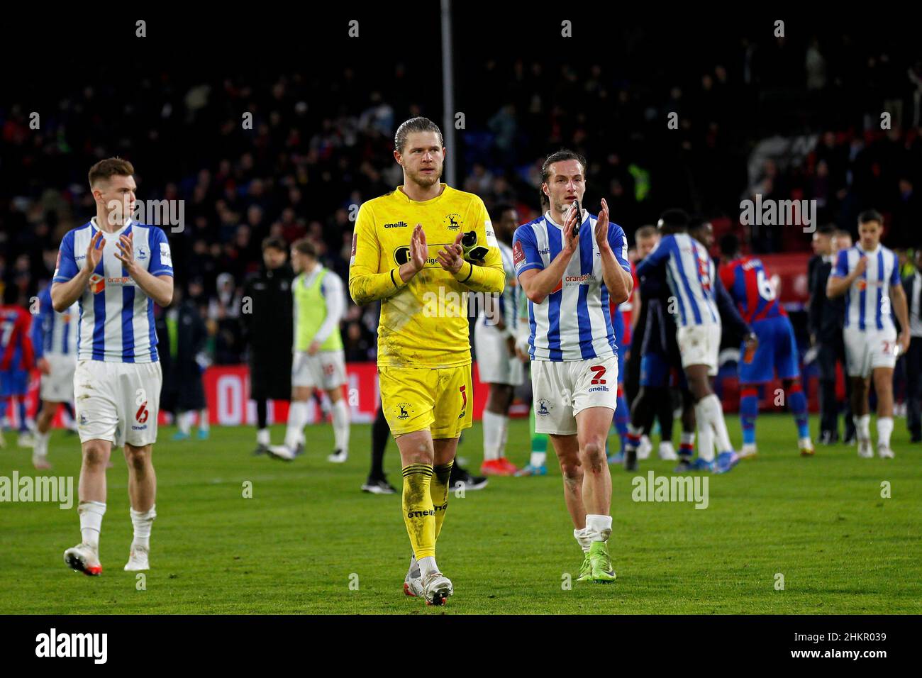 Hartlepool United players applaud their fans at full time Stock Photo