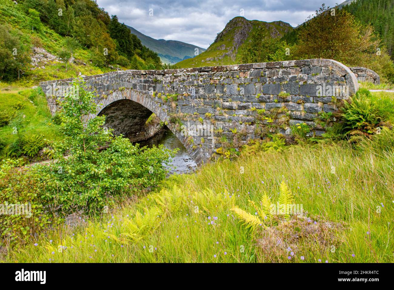 A picture perfect bridge iover a river in the Highlands of Scotland Stock Photo