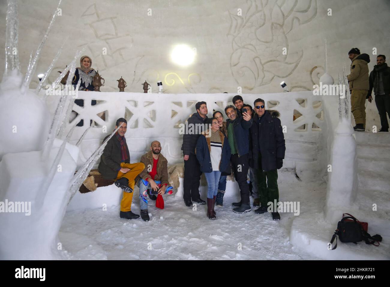 Srinagar, India. 05th Feb, 2022. Indian tourists takes selfie inside Asia's biggest Igloo Cafe made of snow in Gulmarg, Srinagar, India on February 5, 2022. The Igloo Cafe is approximately 37.5 feet tall and 45 feet round and can accommodate fifteen tables and around 60 guests. The Igloo Cafe offers tables made of ice and snow, with hot dishes served to visitors. (Photo by Sajad Hameed/Pacific Press/Sipa USA) Credit: Sipa USA/Alamy Live News Stock Photo