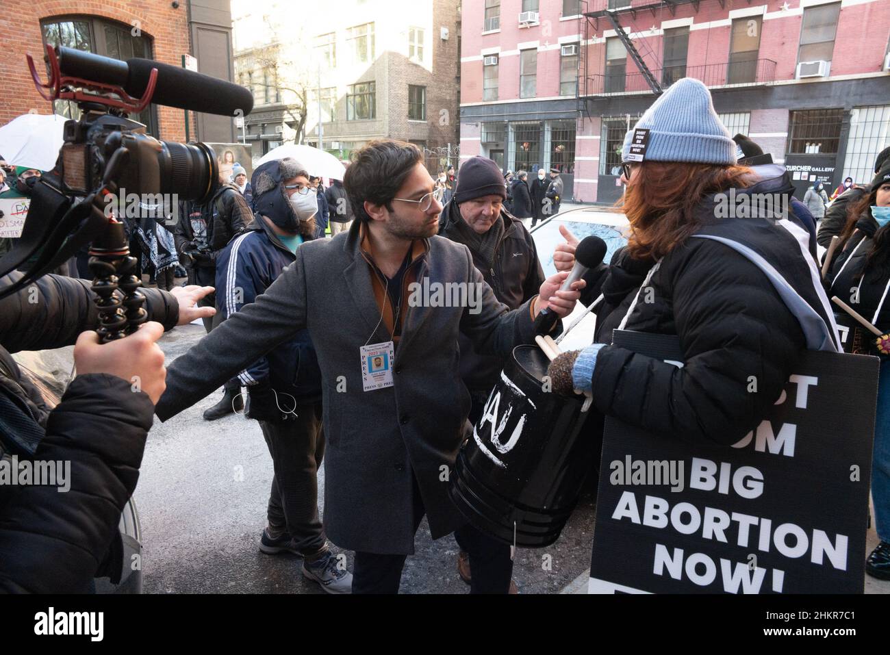 New York, New York, USA. 5th Feb, 2022. A Journalist attempts an interview while be attacked by a Pro-life demonstrator during a rally and protest at planned parenthood on Mott Street in New York. In 2021Texas passed SB8 which effectively bans nearly all abortions in the state. The ban may effect Roe v. Wade and the Supreme Court has yet to rule. (Credit Image: © Brian Branch Price/ZUMA Press Wire) Stock Photo