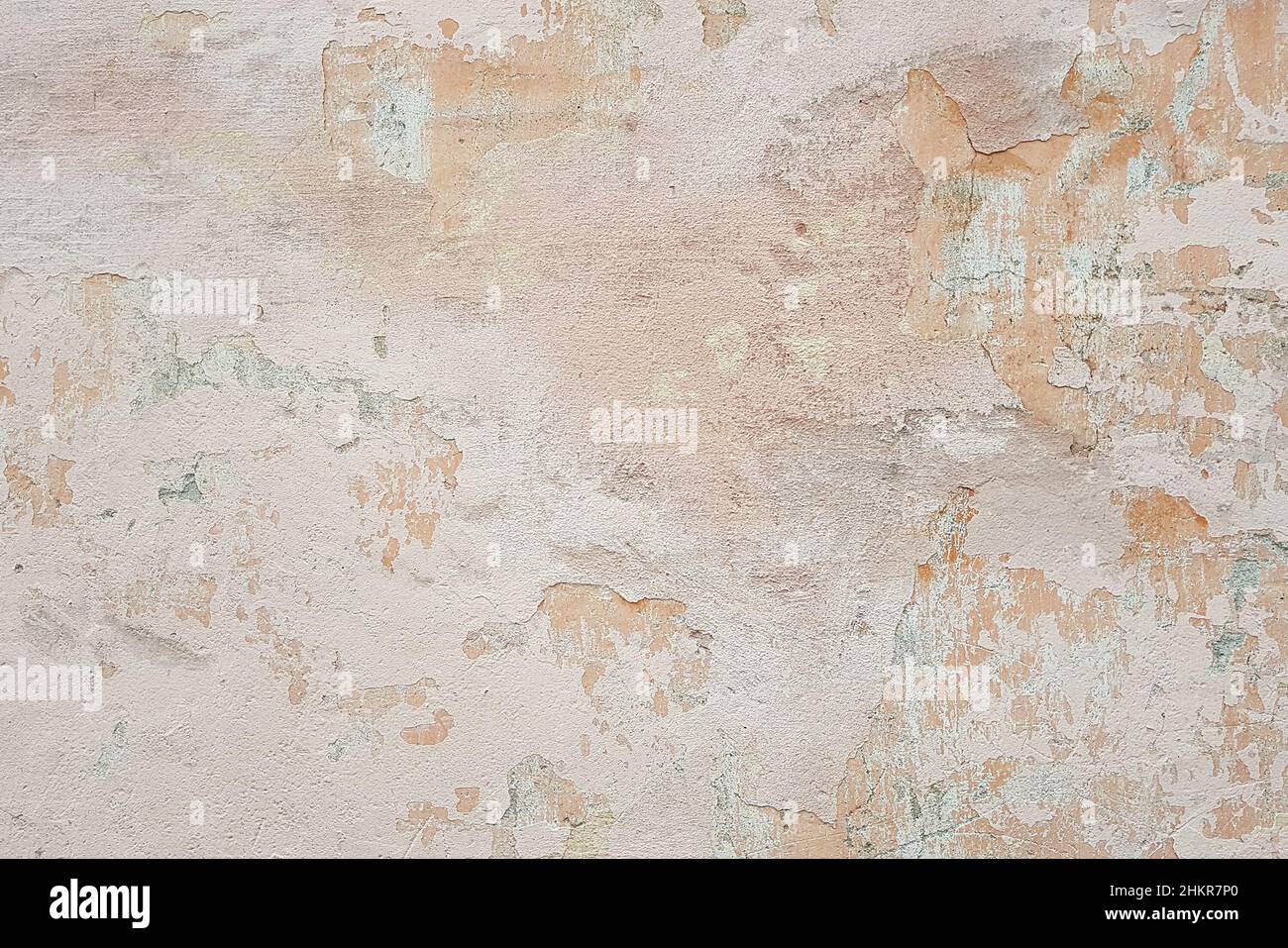 surface of old shabby wall with falling off plaster, beige-pink shades, background, texture Stock Photo