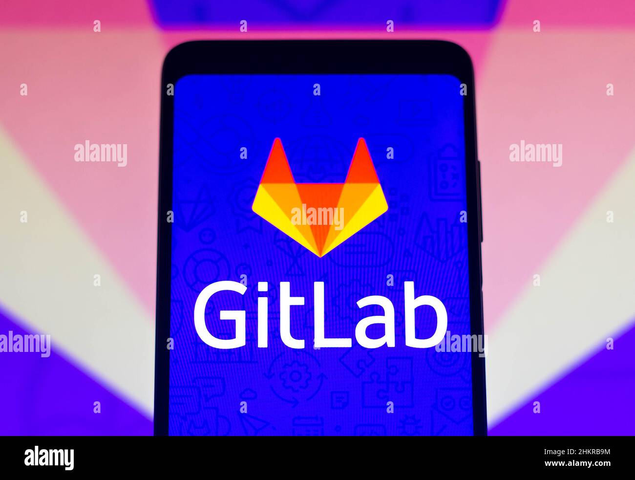 In this photo illustration the GitLab logo seen displayed on a ...
