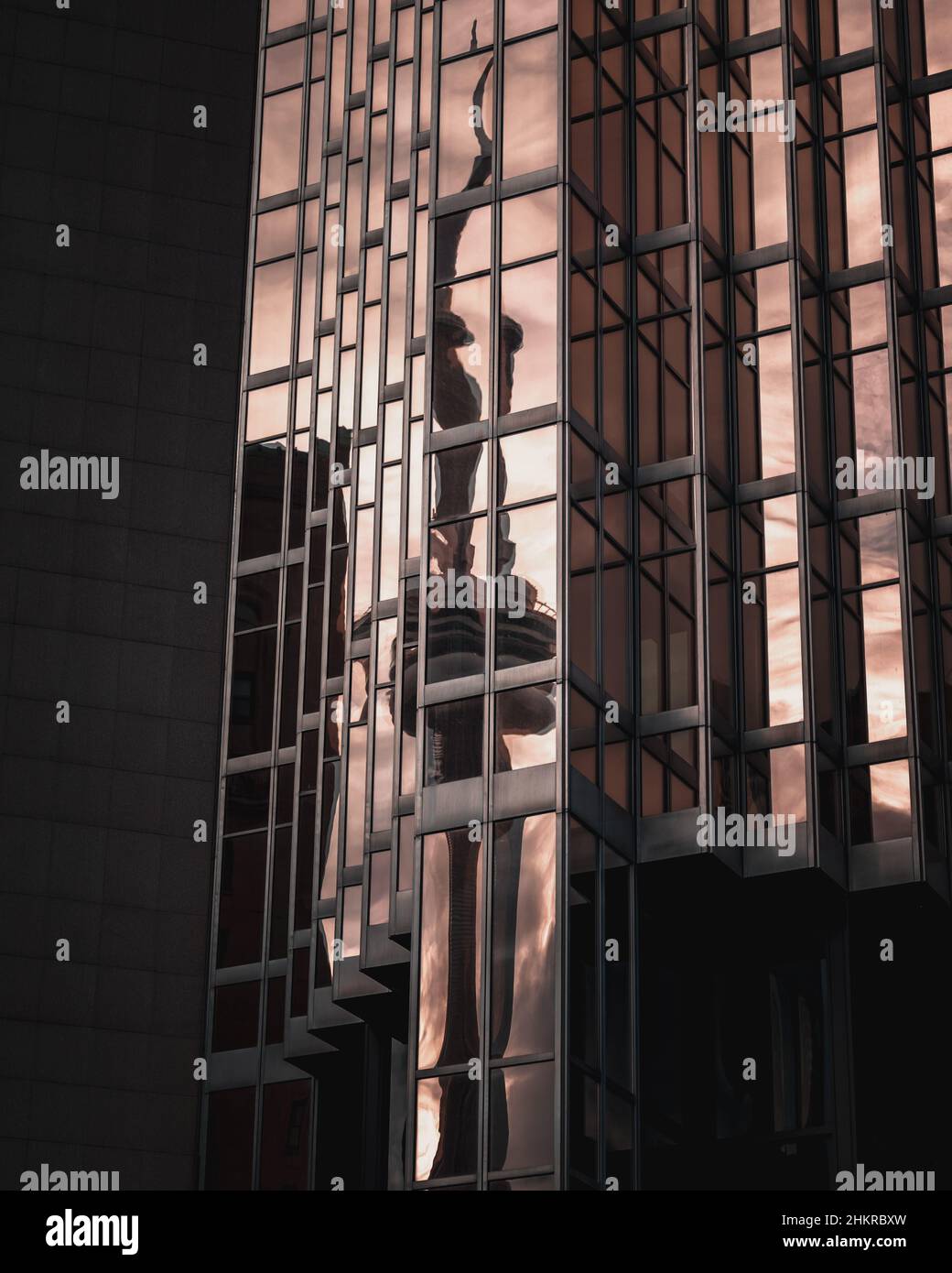 Vertical shot of a mirror building reflecting the sky Stock Photo - Alamy