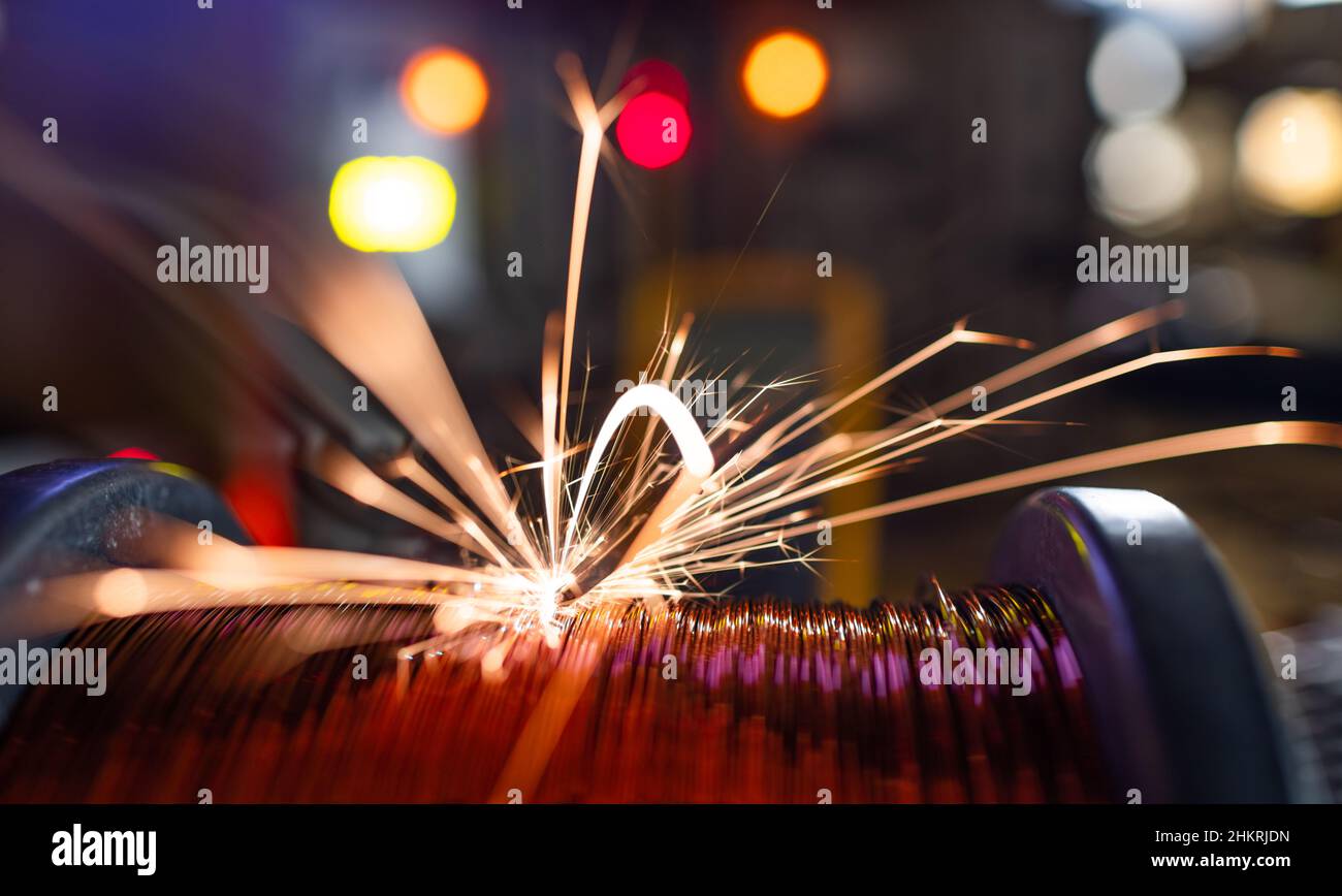 Electric bright dangerous sparks scatter sharply and quickly to the sides from an unsafe short