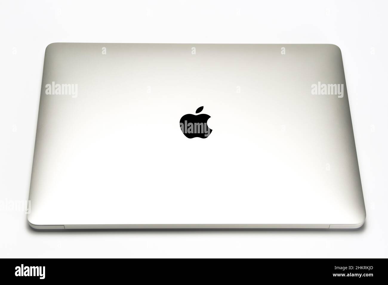 Apple company logo seen on Macbook M1 laptop isolated on white. Selective focus. United Kingdom, Stafford, December 18, 2021. Stock Photo