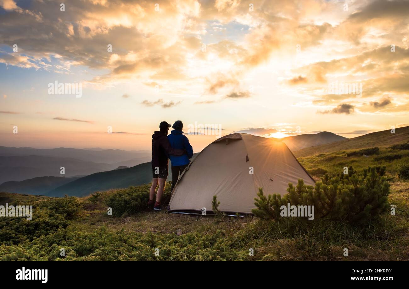 Camping and couple on the top of high mountains Stock Photo
