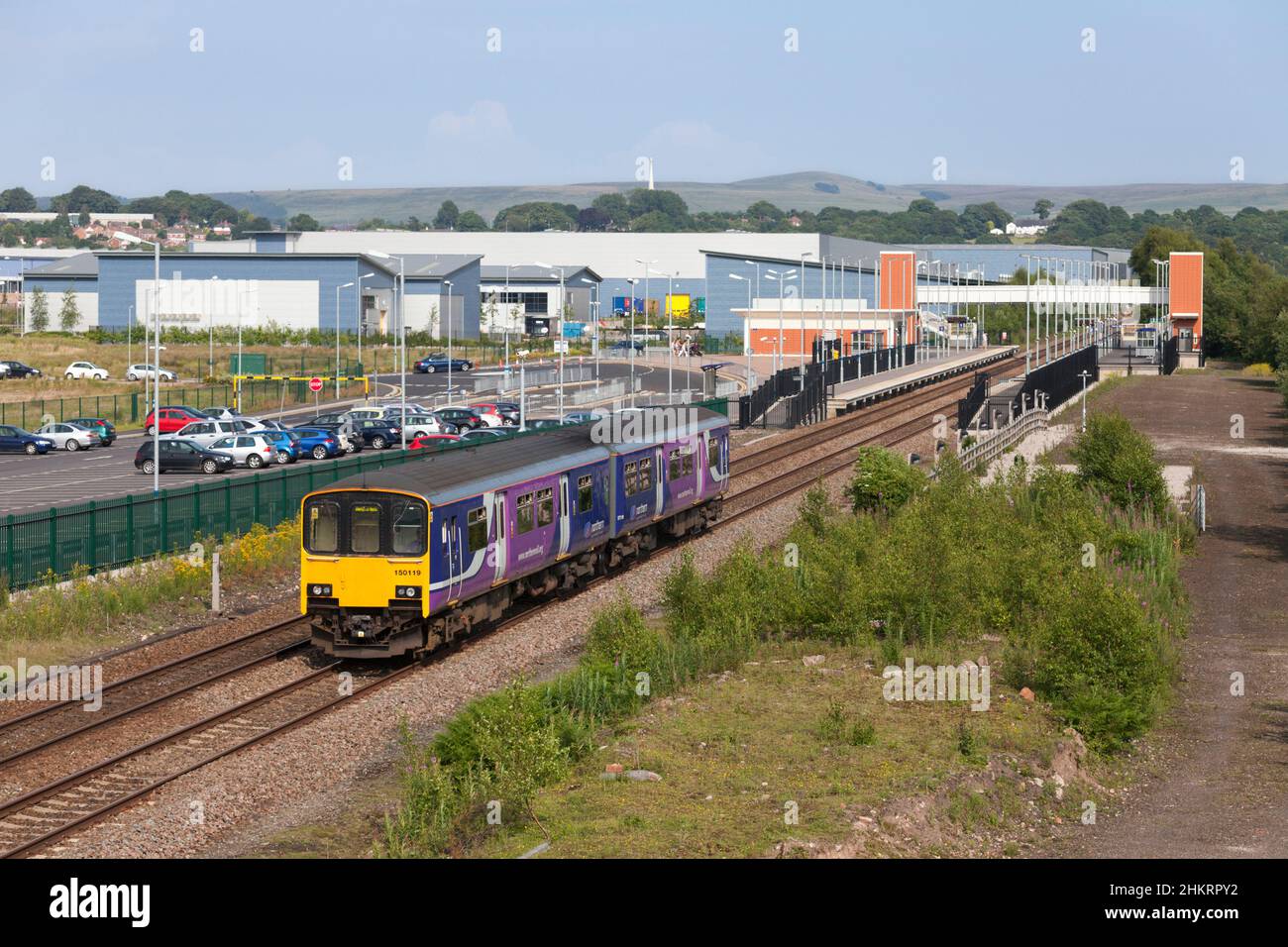 Northern Rail class 150 sprinter train 150119  at Buckshaw parkway railway station with a train diverted away from the mainline by engineering work. Stock Photo