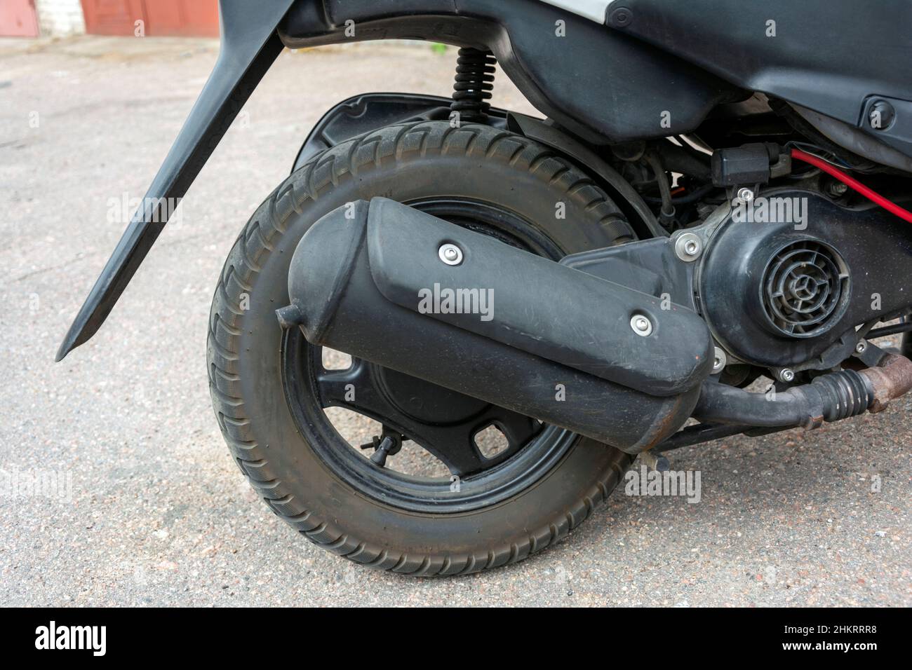Scooter rear wheel, Exhaust pipe, scooter rear suspension Stock Photo